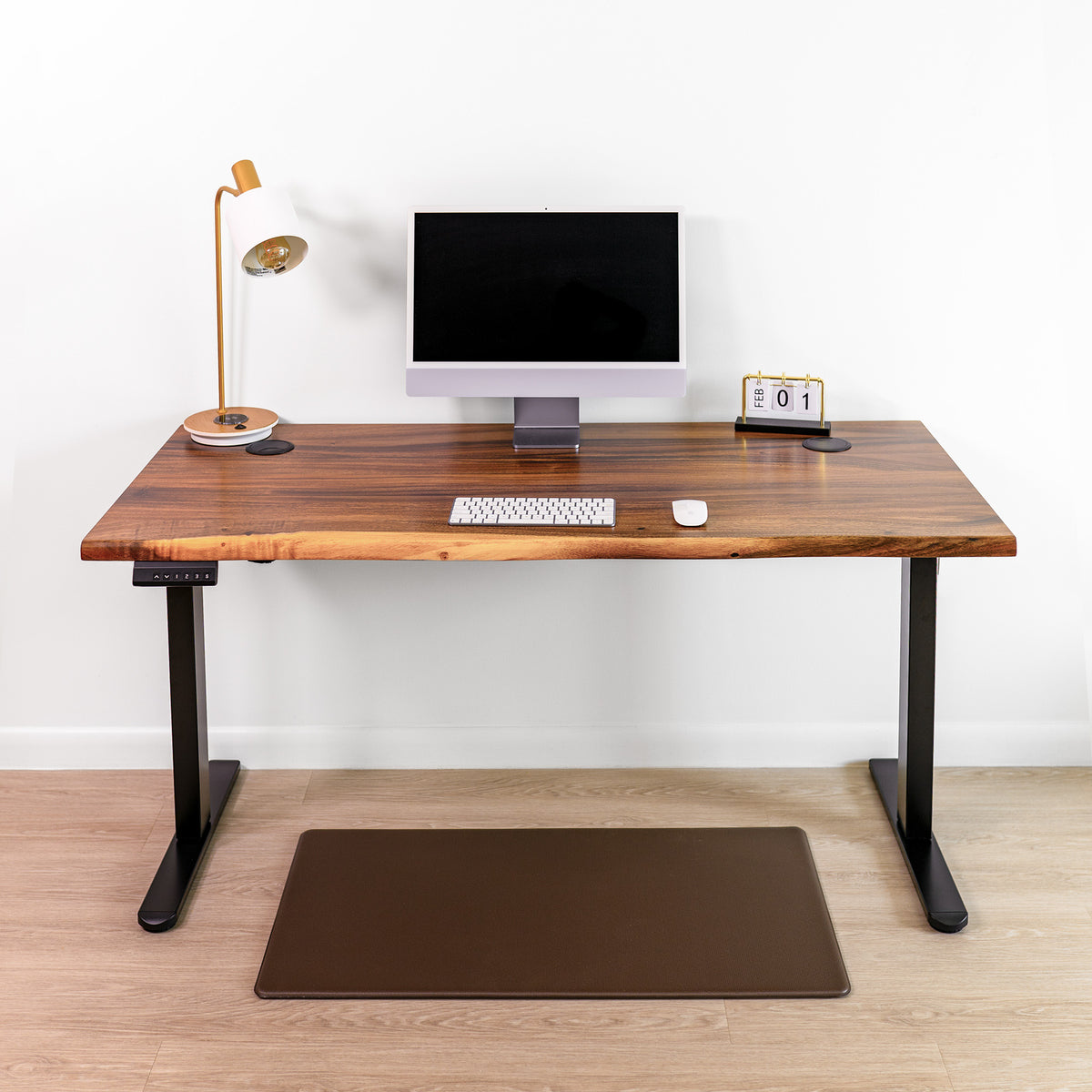 Adjustable standing desk with dual motor legs, warm brown walnut wood, natural live edge, and eco-friendly finish.