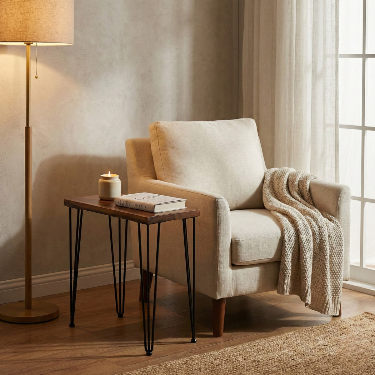 Cozy living room with beige armchair, walnut side table, and standing lamp.