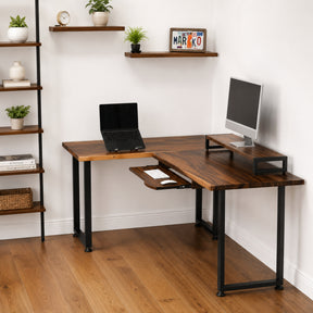 Walnut solid wood L-shaped desk with keyboard tray, computer setup in a home office.