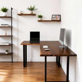 Modern home office with a walnut solid wood L-shaped desk, computer setup, and shelves with plants.