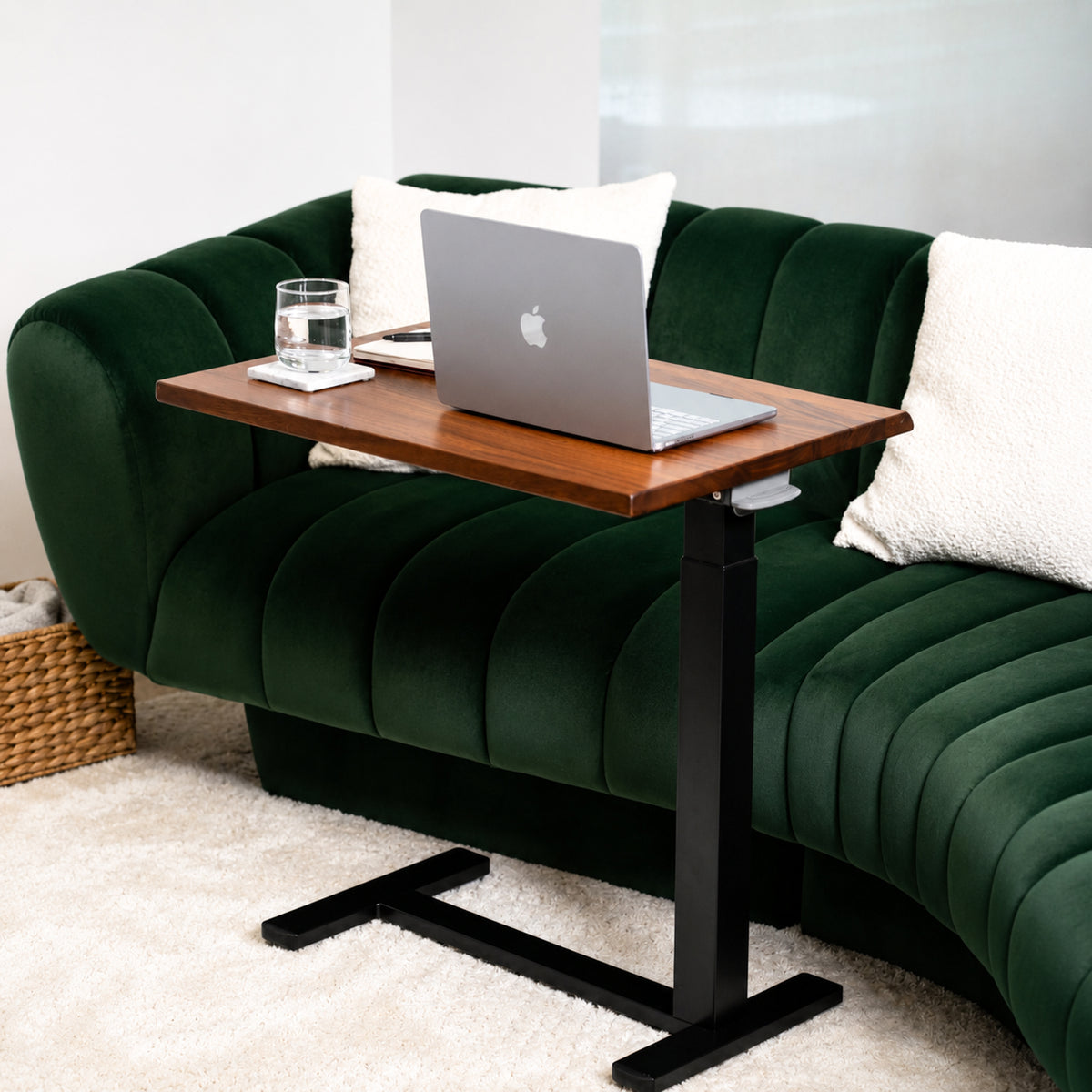 Solid walnut rolling laptop desk with live-edge top, black pneumatic frame, and low-profile wheeled base