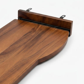 Close-up of a walnut keyboard tray with a rich medium-brown wood grain, featuring a raised end piece with two black metal mounting brackets, shown on a clean white background.