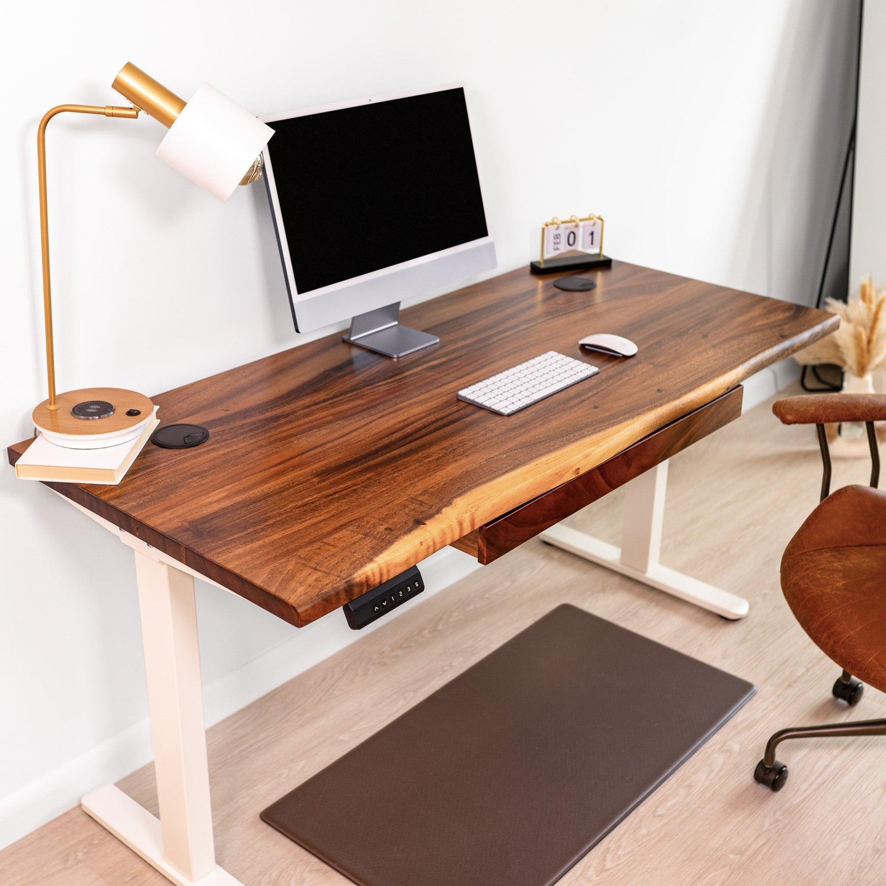 Modern standing desk with drawers, featuring a live edge walnut desktop, white adjustable frame, ergonomic office setup.