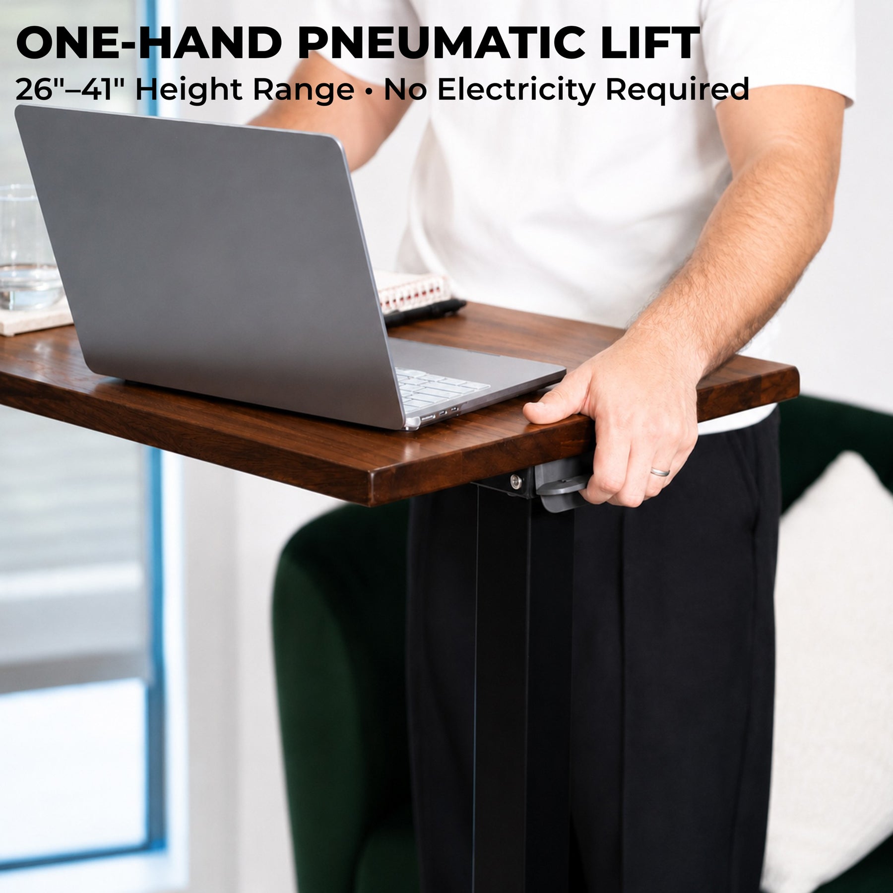 One-hand pneumatic height adjustment on a solid walnut laptop desk with a 26-to-41-inch range and no electricity
