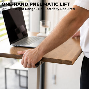 One-hand pneumatic height adjustment on a white oak laptop desk with a 26-to-41-inch range