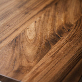 Close-up of a walnut coffee table with visible grain and texture