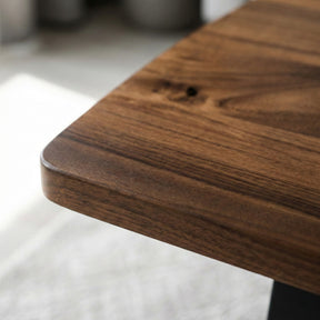 Close-up of a walnut coffee table  with a blurred background