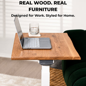 Solid white oak mobile laptop desk styled as a compact workspace in a modern living room