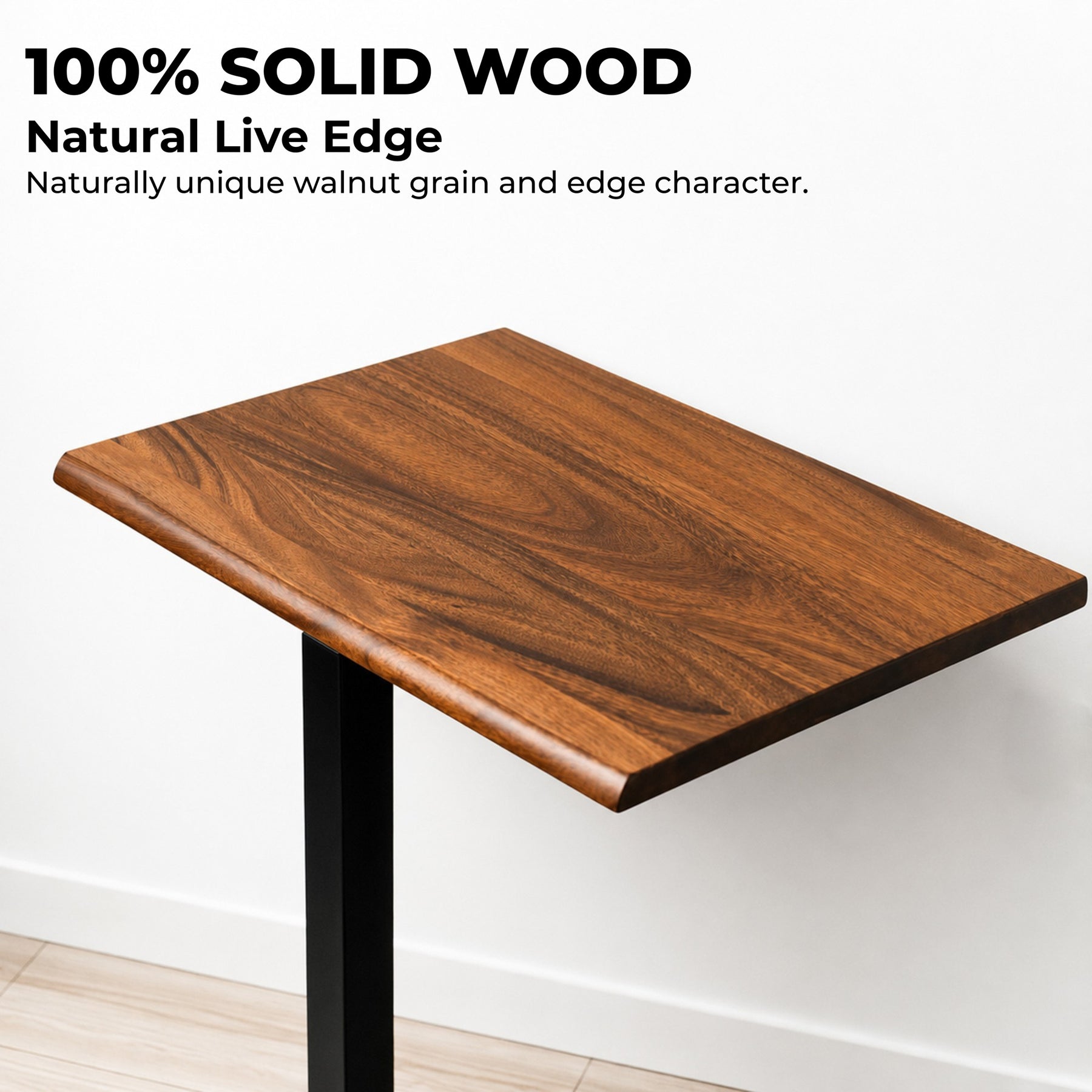 Close-up of a 100% solid walnut desktop with natural grain and rounded live edge on a mobile standing desk