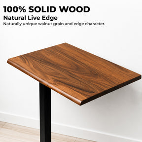 Close-up of a 100% solid walnut desktop with natural grain and rounded live edge on a mobile standing desk