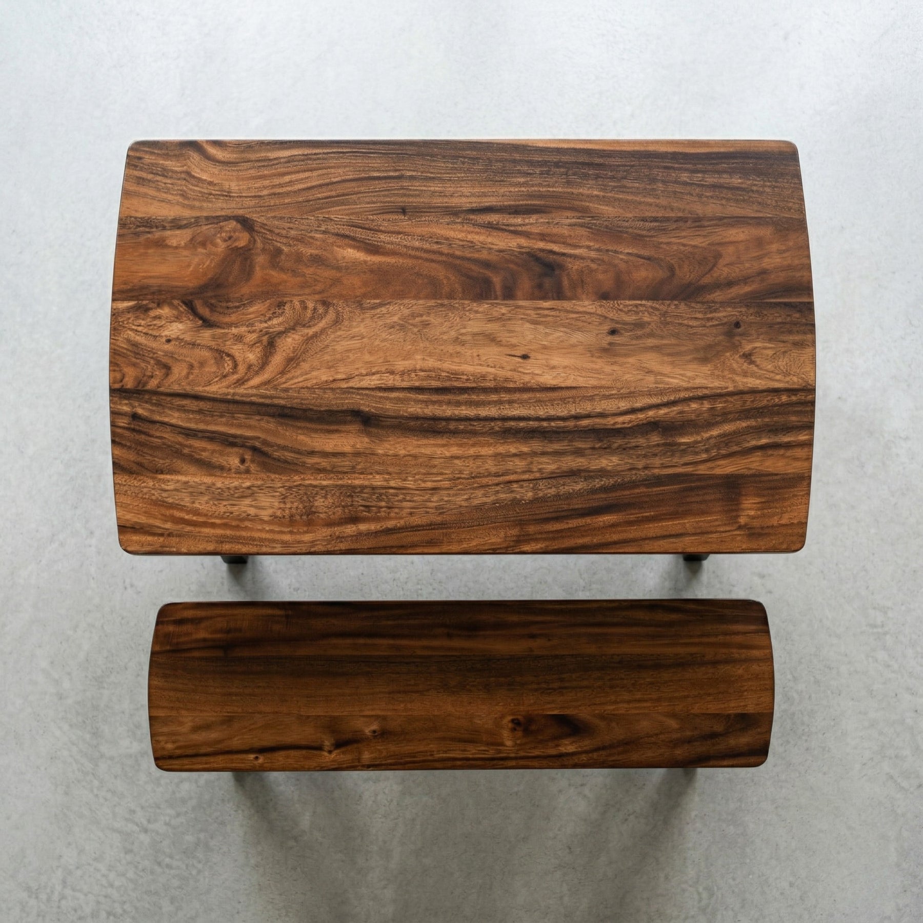 Solid walnut dining table with bench on a light gray background