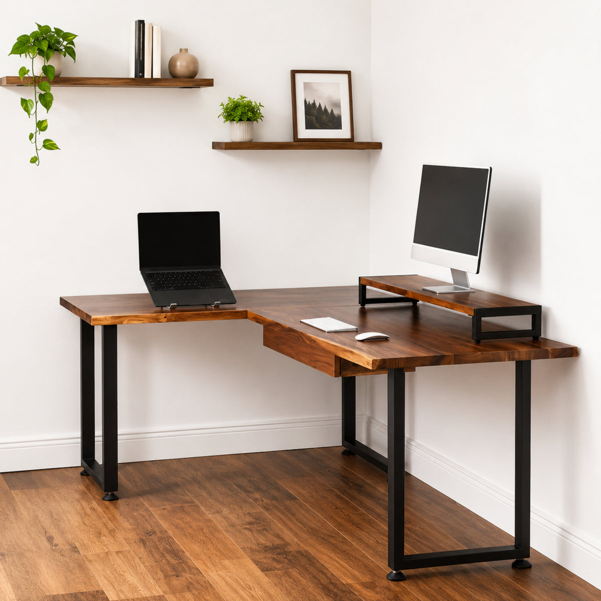 Walnut solid wood L-shaped desk with drawer, laptop, and monitor setup in a home office.