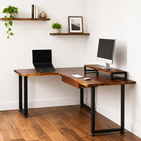 Walnut solid wood L-shaped desk with drawer, laptop, and monitor setup in a home office.