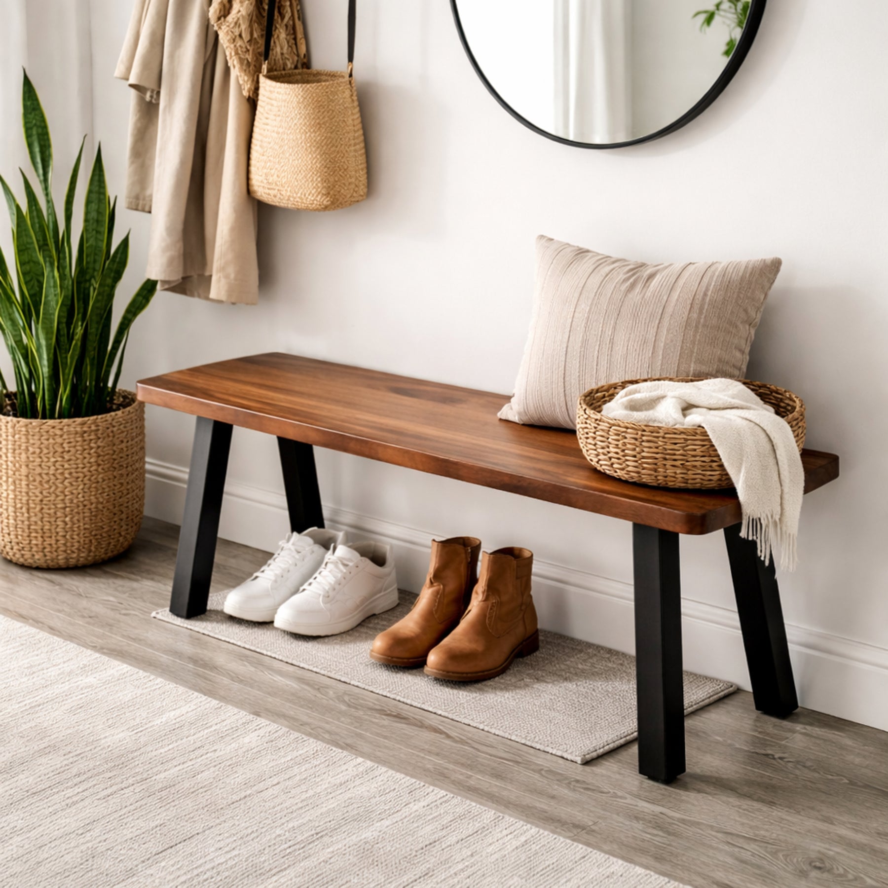 Walnut entryway bench in a hallway with shoes, a plant, and a mirror.