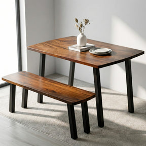 Solid walnut dining table with bench in a minimalistic room
