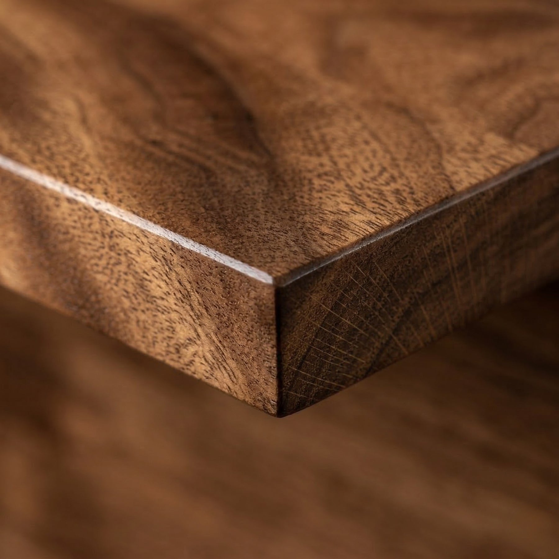 Close-up of a wood shelf with a visible walnut grain pattern