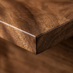 Close-up of a wood shelf with a visible walnut grain pattern