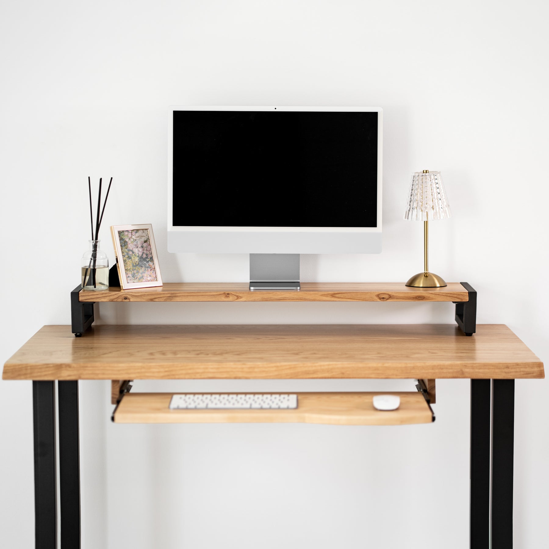 White oak computer desk with keyboard tray, computer setup on a white background