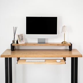 White oak computer desk with keyboard tray, computer setup on a white background