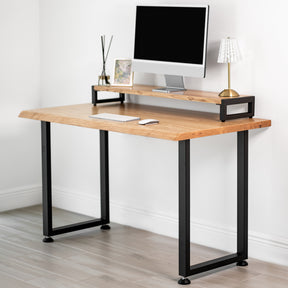 White oak computer desk with a drawer, black metal legs, in a room setting